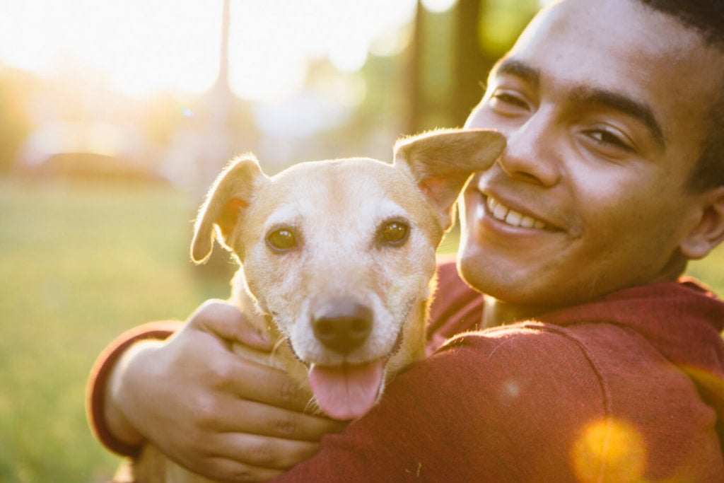 Man hugging a dog